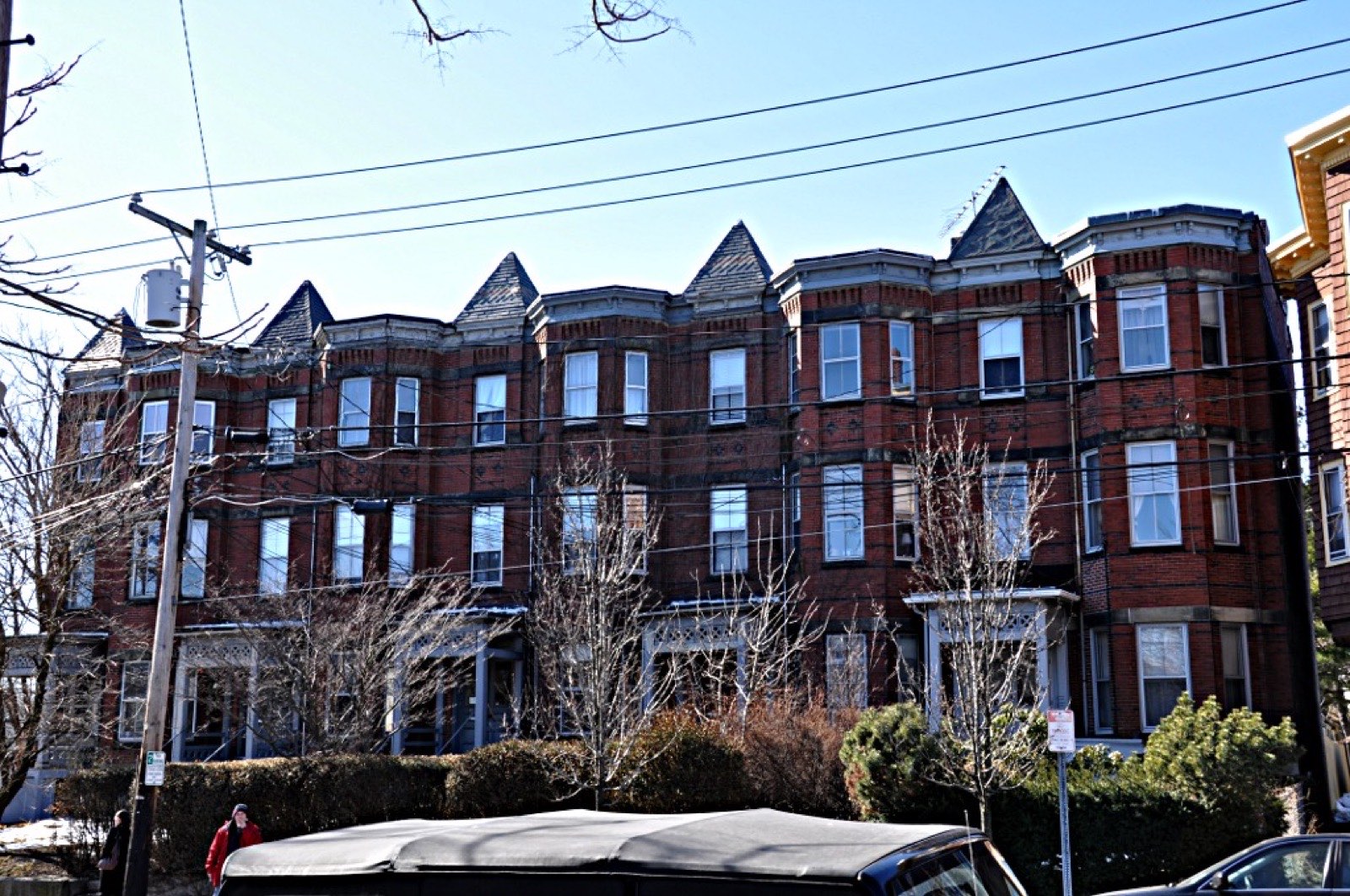 Brick rowhouses at 28-36 Beacon Street, built on former brickyard ground, the kind of settled building a Somerville bathroom remodel has to work with