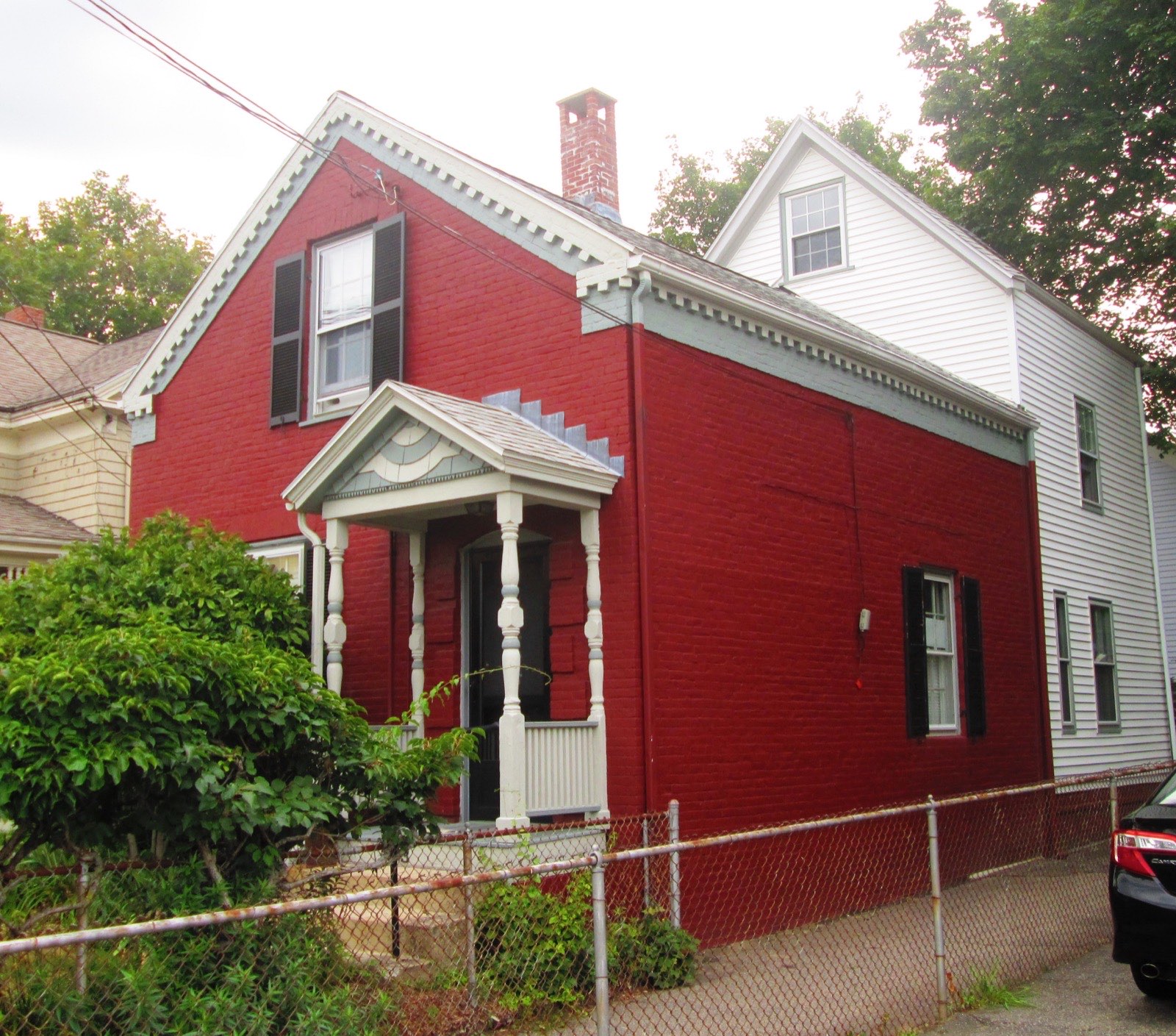 A brick worker's cottage on Dover Street built hard against its neighbor, typical of the buildings our Somerville bathroom remodeling work happens in