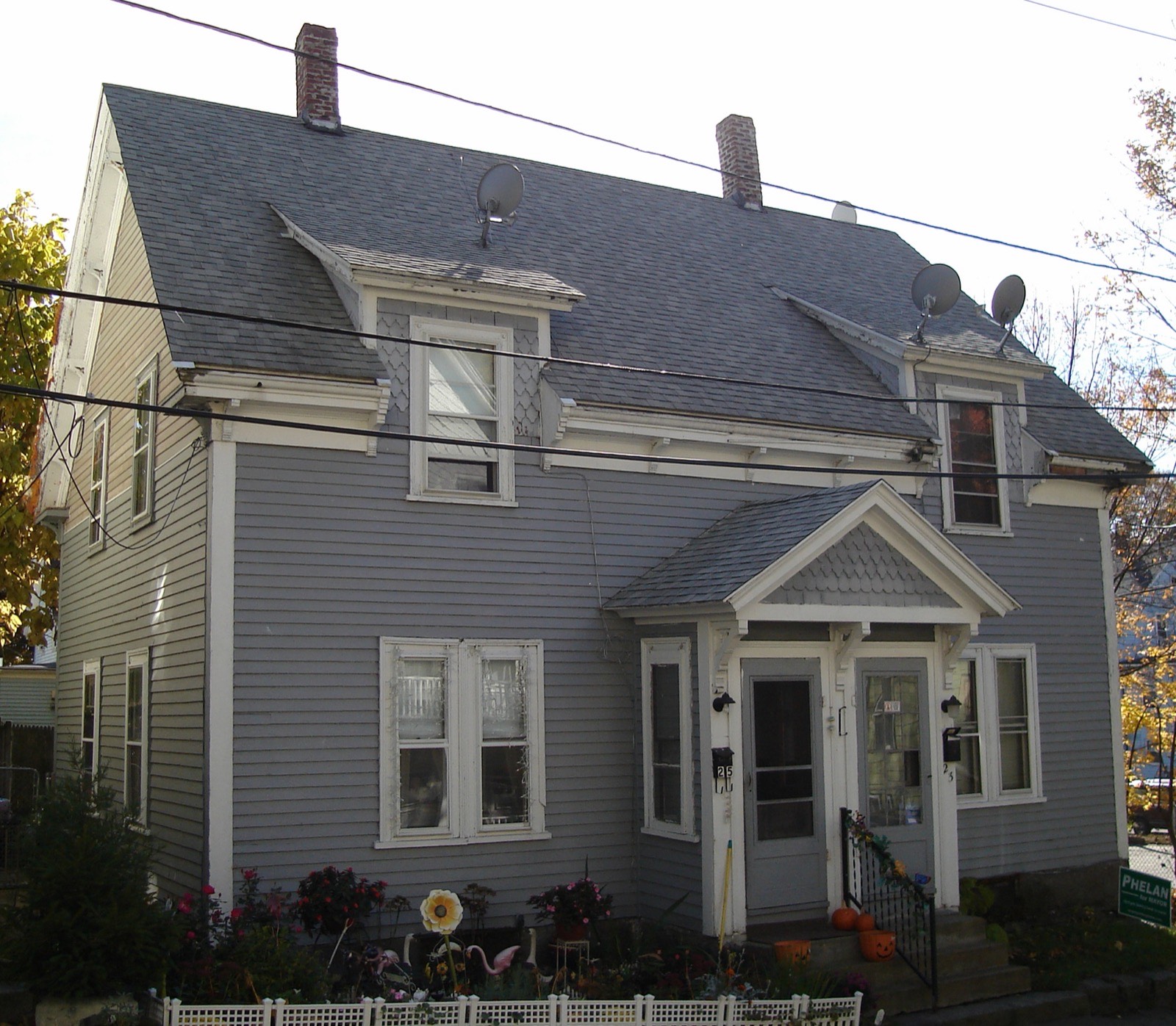 A two-family worker's house on Prout Street with paired front doors, a common starting point for a Quincy bathroom renovation