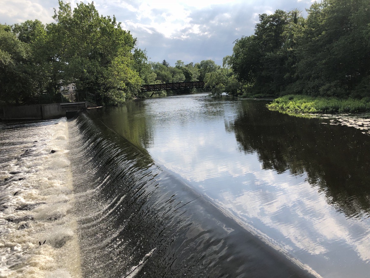 The Charles River going over the Watertown Dam, a short walk from most of our Watertown bathroom renovation work