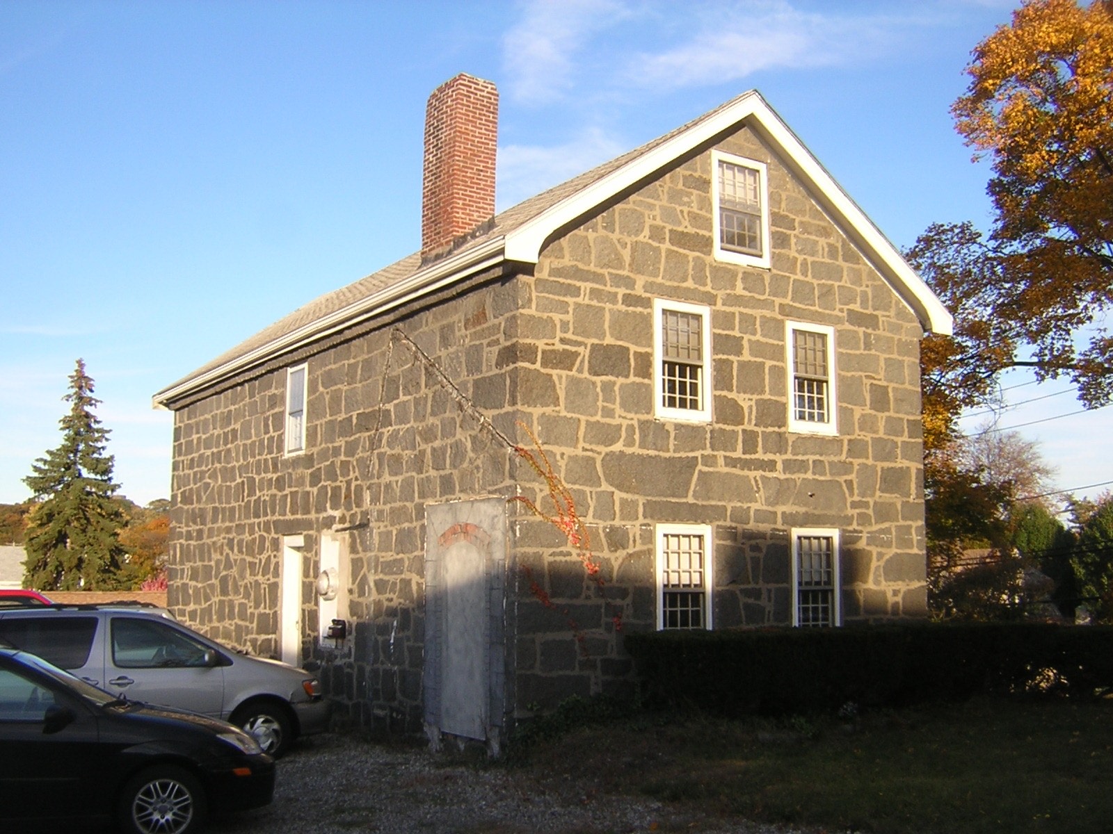 A granite block house on Willard Street in West Quincy, the kind of stone-walled home our Quincy bathroom remodeling work runs into